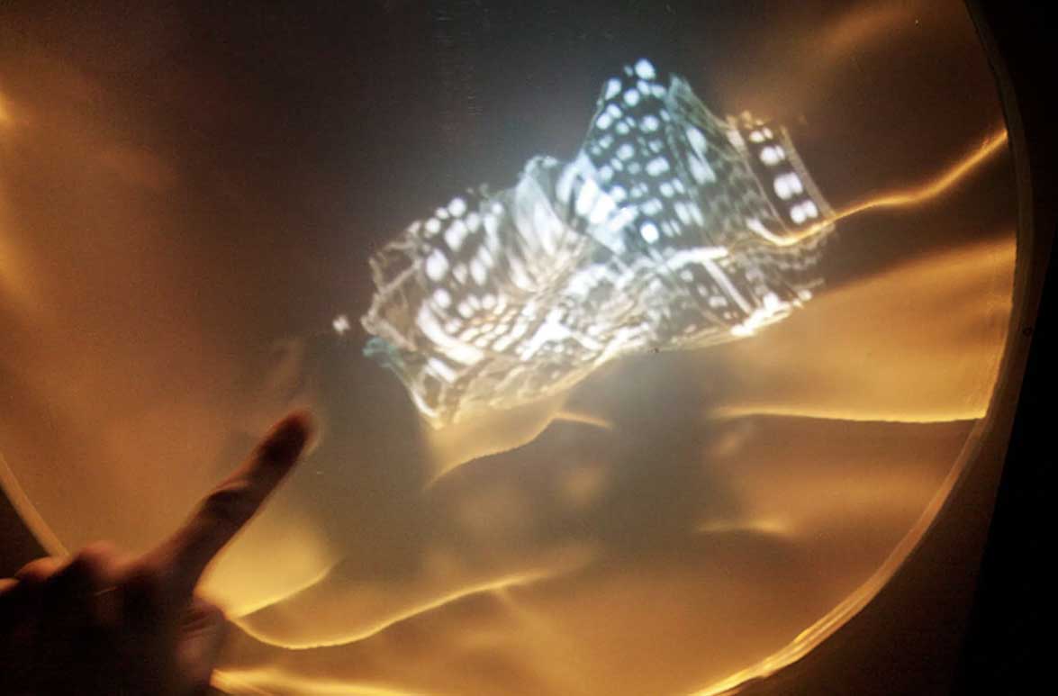 Finitude (Mallee: Time) - participant interacting with luminous imagery